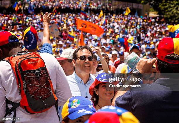 supporters of venezuelan presidential candidate enrique capriles radonski in parade - protests in venezuela as political crisis continues stock pictures, royalty-free photos & images