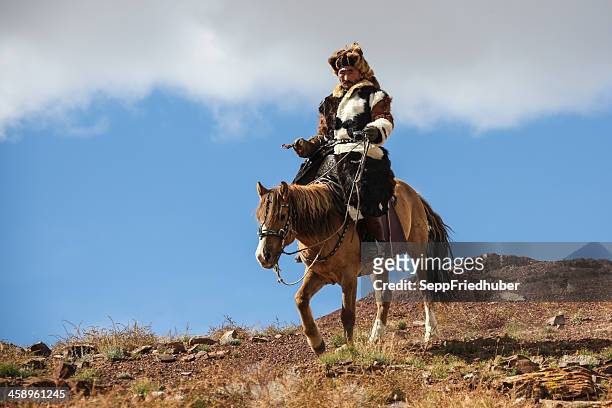mongolian horseman riding - kazakhstan steppe stock pictures, royalty-free photos & images