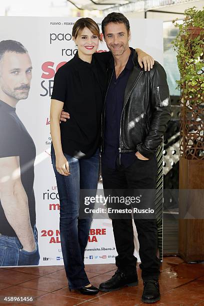 Paola Cortellesi and Raoul Bova attends the "Scusate Se Esisto!" photocall at Cinema Barberini on November 14, 2014 in Rome, Italy.
