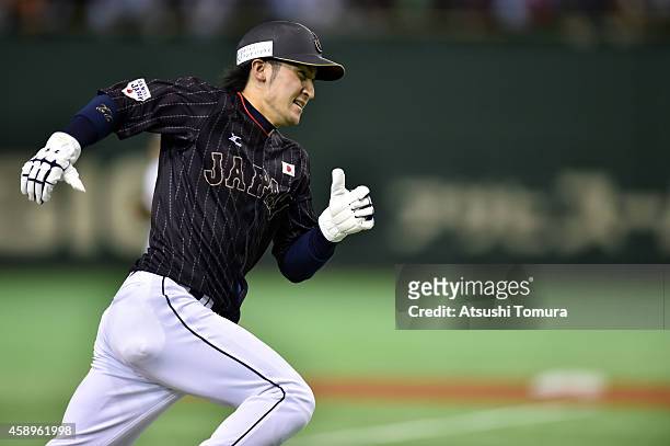 Hikaru Ito of Samurai Japan runs home in the eighth inning during the game two of Samurai Japan and MLB All Stars at Tokyo Dome on November 14, 2014...