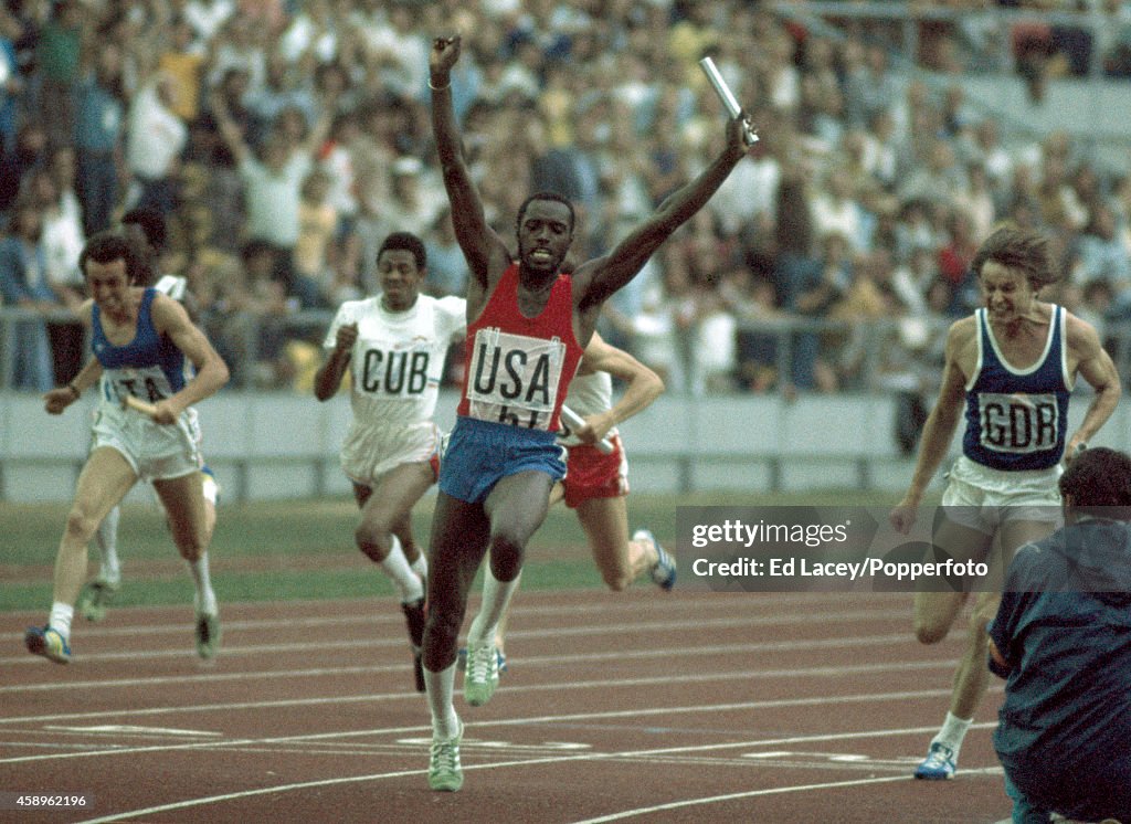Steve Riddick of the United States team raises his arms in the air ...