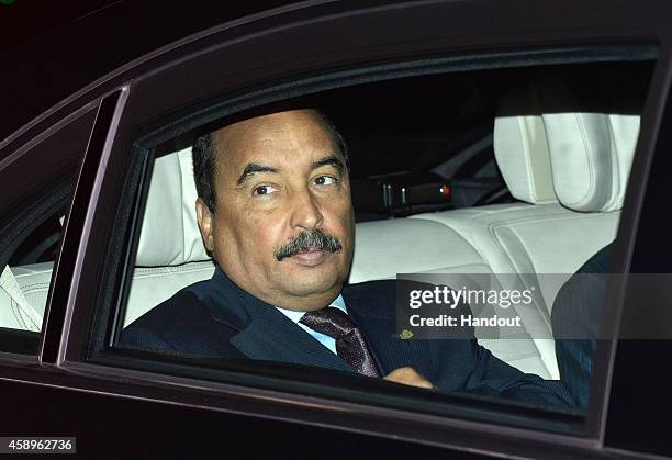 In this handout photo provided by the G20 Australia, Mauritania's President Mohamed Ould Abdel Aziz arrives in Brisbane at the G20 Terminal on...