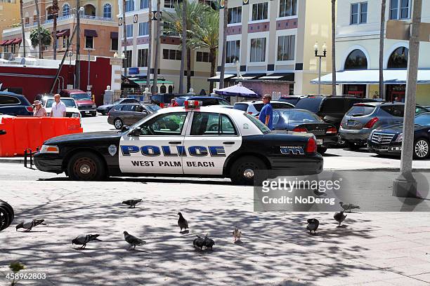 west palm beach police car on city street - west palm beach stock pictures, royalty-free photos & images