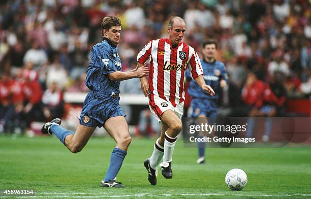 Sheffield United forward Alan Cork outpaces Gary Pallister of Manchester United during the first round of FA Premier League games at Bramall Lane on...