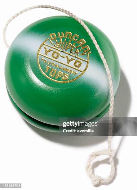 green yo-yo on white - yo yo stock pictures, royalty-free photos & images