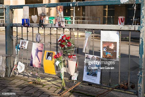 General view of photographs and messages of condolences on the traffic island as a memorial bench for the late Rik Mayall is unveiled on November 14,...