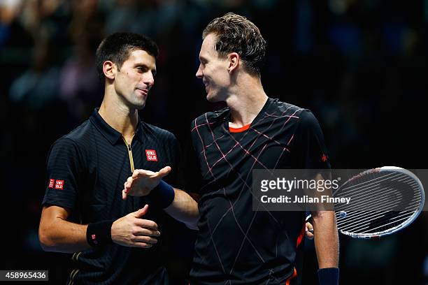 Novak Djokovic of Serbia shakes hands with Tomas Berdych of Czech Republic at the net after the round robin singles match on day six of the Barclays...