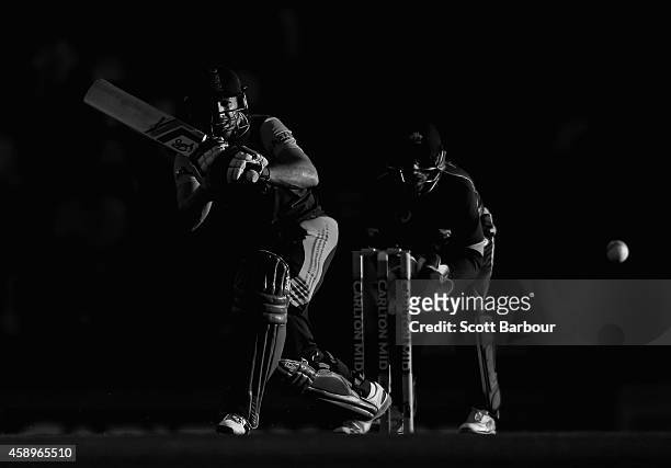 De Villiers of South Africa bats as wicketkeeper Matthew Wade of Australia looks on during game one of the men's one day international series between...
