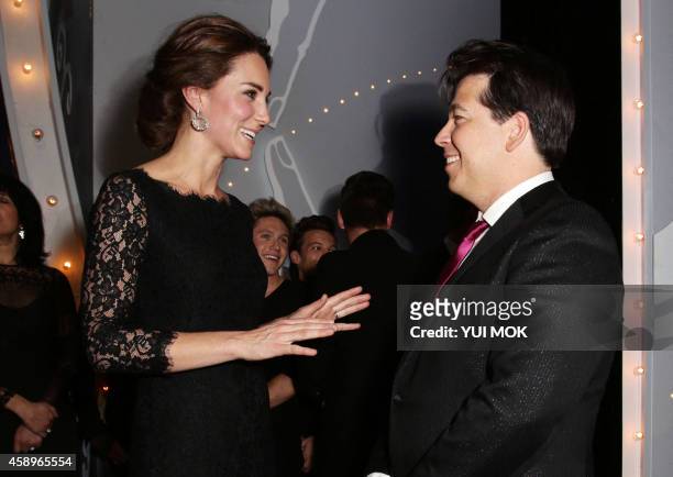 Britain's Catherine, Duchess of Cambridge meeting the host of the show, British comedian Michael McIntyre following the Royal Variety Performance at...