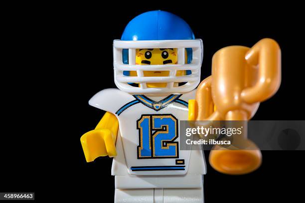 lego minifigures series 8 figurine: football player - guy playing with lego stock pictures, royalty-free photos & images