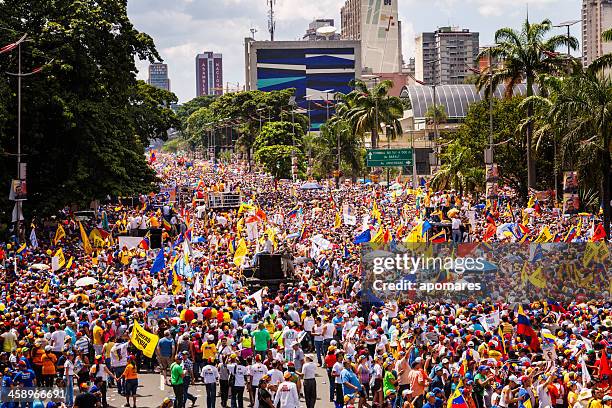 supporters of venezuelan presidential candidate enrique capriles radonski in parade - protests in venezuela as political crisis continues stock pictures, royalty-free photos & images