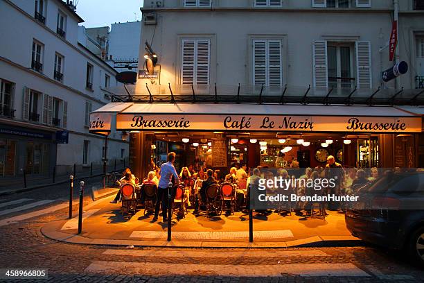 vibrant evening - paris restaurant stock pictures, royalty-free photos & images