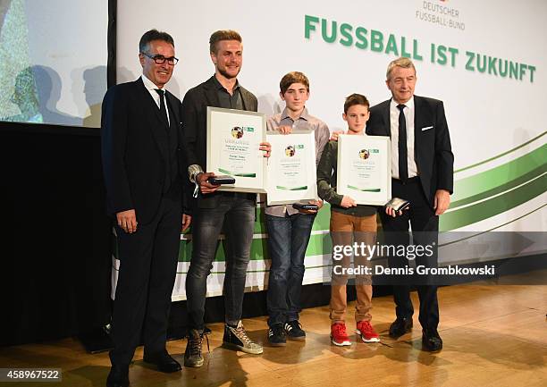 Flrorian Trinks, Benjamin Jaeger and Till Bartlog pose during the Club 100/Fair ist mehr Award Ceremony at Rathaus Nuernberg on November 14, 2014 in...