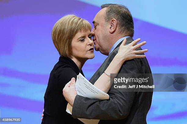 First Minister of Scotland Alex Salmond, is kissed by Nicola Sturgeon before his last key note speech as party leader of the SNP at the partys annual...