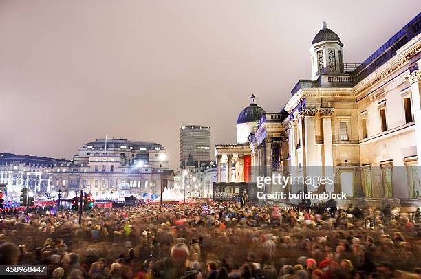 crowd in trafalgar square london celebrating chinese new year - trafalgar square timelapse stock pictures, royalty-free photos & images