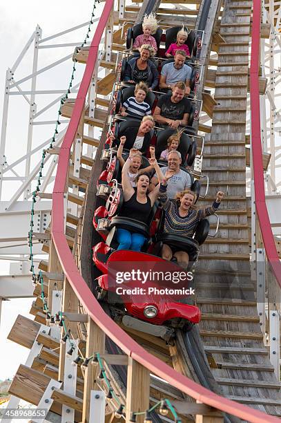 riders scream on a ride at stockholm's grona lund - young woman screaming on a rollercoaster stock pictures, royalty-free photos & images