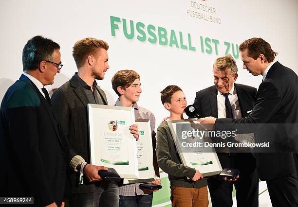 Flrorian Trinks, Benjamin Jaeger and Till Bartlog pose during the Club 100/Fair ist mehr Award Ceremony at Rathaus Nuernberg on November 14, 2014 in...