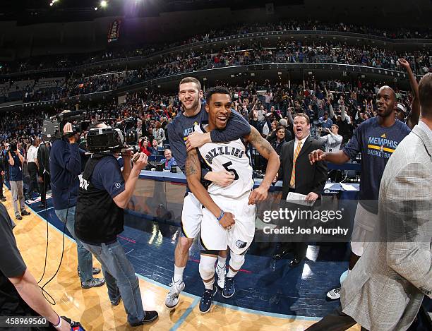 Jon Leuer of the Memphis Grizzlies congratulates and celebrates with Courtney Lee after he hit the winning shot against the Sacramento Kings on...