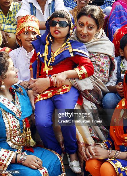 Union HRD Minister Smriti Irani interacts with children during Bal Diwas celebrations at Bal Bhavan on November 14, 2014 in New Delhi, India. The...