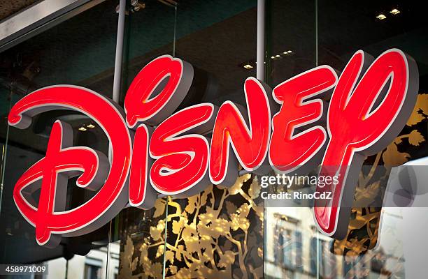 disney logo on shop window - disneyland stock pictures, royalty-free photos & images