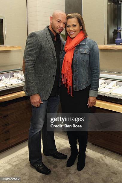 Celebrity trainer David Buer and WSB-TV news anchor Jovita Moore attend the grand re-opening of the David Yurman boutique on November 13, 2014 in...