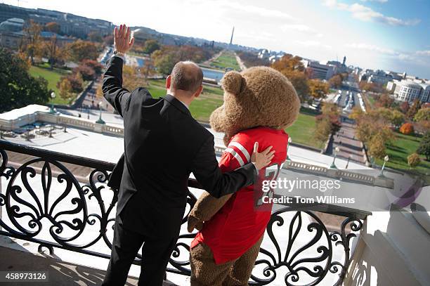Rep. Tom Reed, R-N.Y., and "Touchdown," the bear mascot for Cornell University, visit the Speaker's balcony in Capitol during a visit to celebrate...
