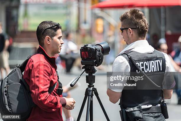 security guard with photographer - guard stock pictures, royalty-free photos & images