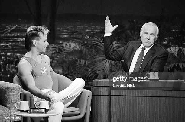 Pictured: Olympic gymnast Kurt Thomas during an interview with host Johnny Carson on May 10, 1990 --