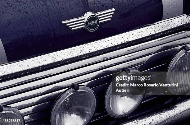 iconic wet mini car - mini cooper stock pictures, royalty-free photos & images