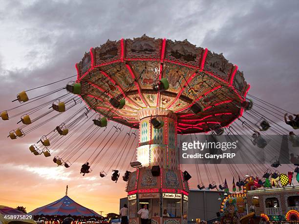 oregon state fair amusement ride wave swinger chair sunset - fairground ride stock pictures, royalty-free photos & images