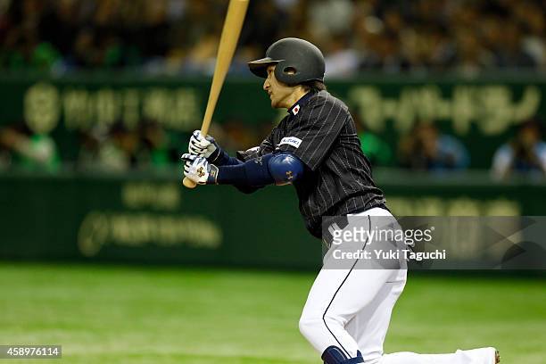 Hikaru Ito of Samurai Japan hits an RBI single in the second inning during the game against the MLB All-Stars at the Tokyo Dome during the Japan...