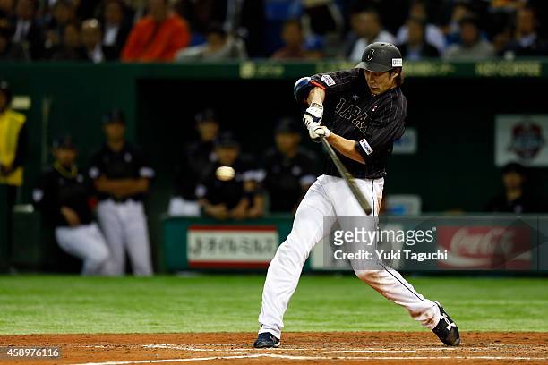 Yuki Yanagita of Samurai Japan hits an RBI single in the fourth inning during the game against the MLB All-Stars at the Tokyo Dome during the Japan...