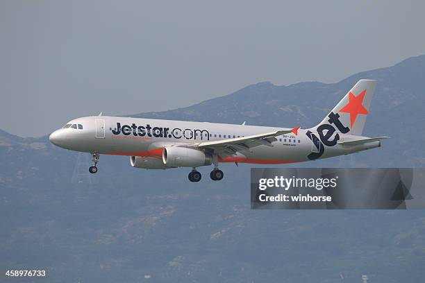 jetstar airways airbus a320 - jetstar plane stock pictures, royalty-free photos & images