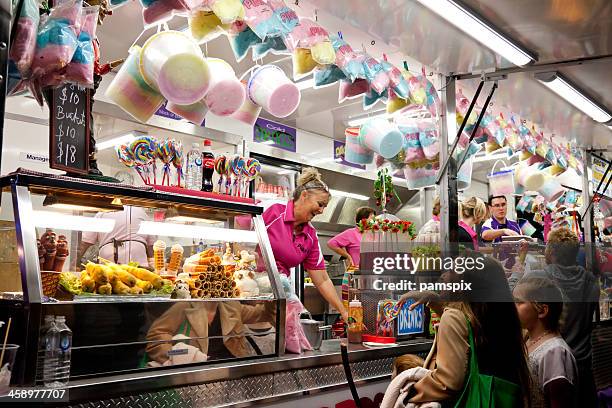 carnival take-away food stall with fairy floss - waitress booth stock pictures, royalty-free photos & images