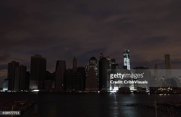 hurricane sandy manhattan blackout second night wtc lit up - blackout stock pictures, royalty-free photos & images