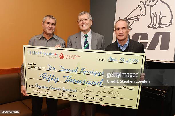 Of Ketchum Sports and Entertainment/T.J. Martell Foundation VP Marcus Peterzell, Dr. David Spriggs, and RCA Records President and COO Tom Corson pose...
