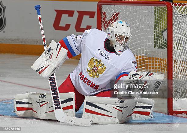 Igor Shesterkin of Team Russia makes a glove save against Team OHL during the 2014 Subway Super Series at the Peterborough Memorial Centre on...