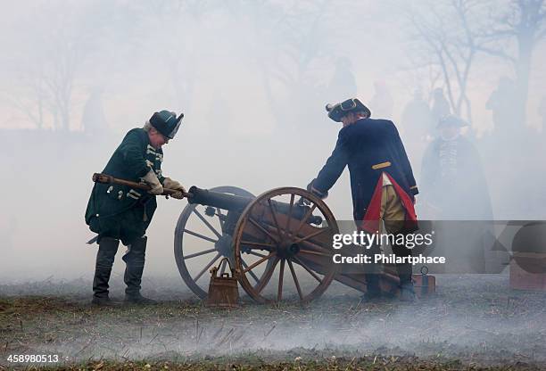 soldiers in historic regimentals with medieval cannon - trooper stock pictures, royalty-free photos & images