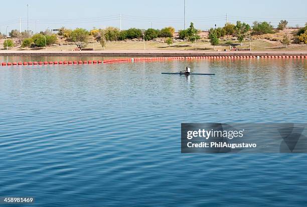 man preparing to row on lake in arizona - tempe arizona stock pictures, royalty-free photos & images