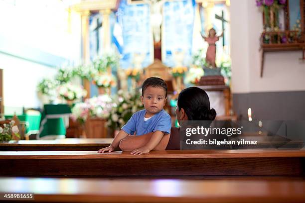 praying in a church - el salvador stock pictures, royalty-free photos & images