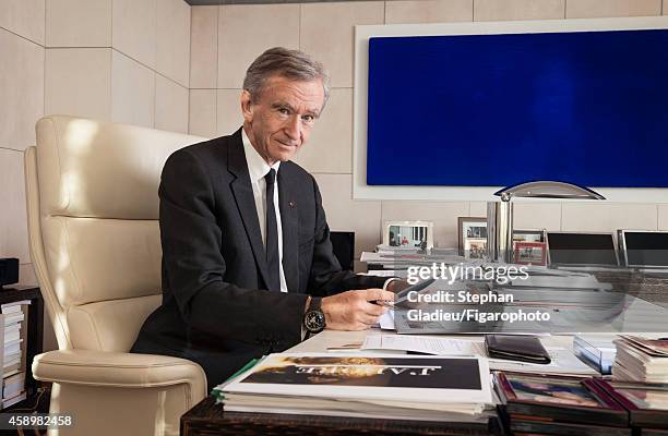 Chairman and CEO of LVMH, Bernard Arnault is photographed for Le Figaro Magazine on October 1, 2014 in his office in Paris, France. On the wall a...