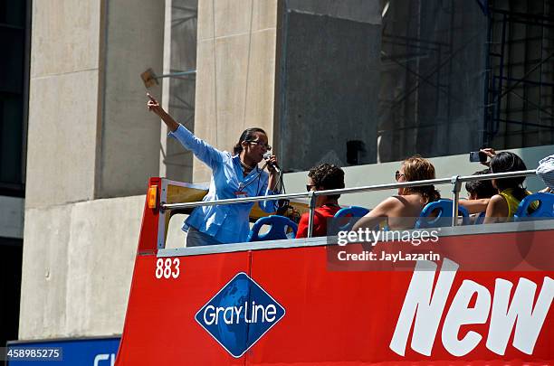 tour guide, tourists, open-air bus, lower manhattan, new york city - bus tour guide stock pictures, royalty-free photos & images