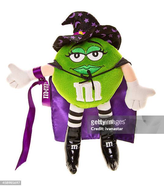 halloween green and purple m&amp;m candy doll with witch hat - letter m stock pictures, royalty-free photos & images