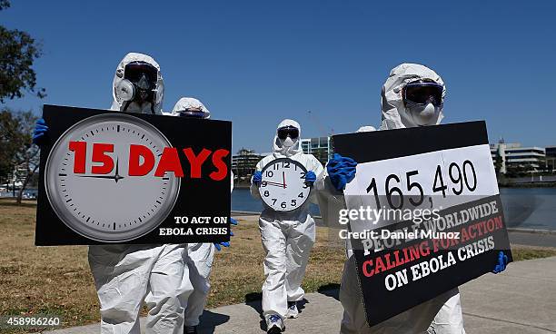 Activist mimicking front line Ebola health workers protest to demand G20 action to fight the disease on November 15, 2014 in Brisbane, Australia....