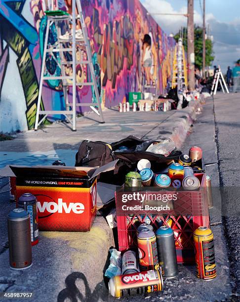 spray painting a graffiti mural in wynwood - wynwood stock pictures, royalty-free photos & images