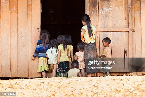 laos kids looking inside classroom - hmong stockfoto's en -beelden