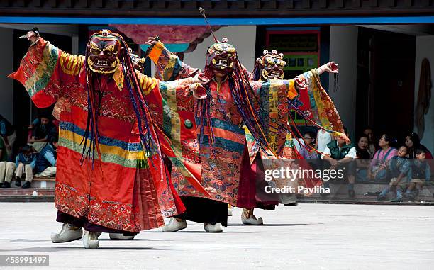 tibetan buddhist monks with masks during festival sikkim - sikkim stock pictures, royalty-free photos & images