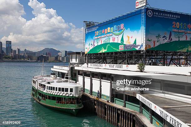 wanchai ferry pier in hong kong - wanchai stock pictures, royalty-free photos & images