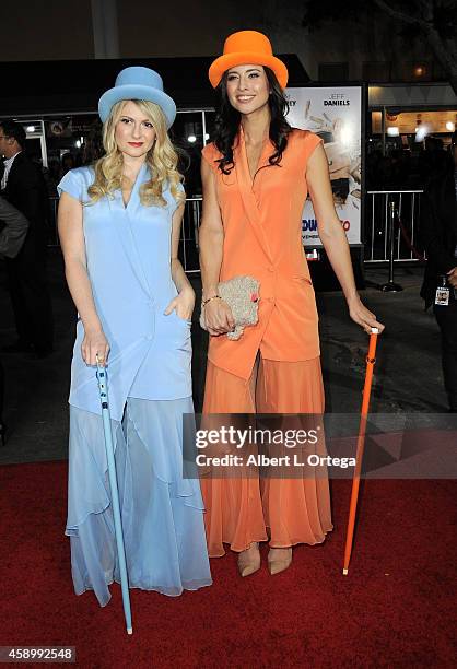 Guests dressed as Harry and Lloyd arrive for the Premiere Of Universal Pictures And Red Granite Pictures' "Dumb And Dumber To" held at the Regency...