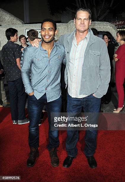 Actors Brandon P Bell and Brian Van Holt arrive for the Premiere Of Universal Pictures And Red Granite Pictures' "Dumb And Dumber To" held at the...